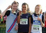 27 November 2011; Nadia Power, Templeogue AC, Dublin, who won the Girl's U14 race at the Woodie’s DIY Inter County Cross Country Championships with second placed Aoife Hamilton, West Waterford AC, right, and third placed Rachael Dunne, Dundrum South Dublin AC, left. Sligo Racecourse, Sligo. Picture credit: Pat Murphy / SPORTSFILE