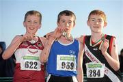 27 November 2011; Fearghal Curtin, Cork, winner of the Boy's U14 race at the Woodie’s DIY Inter County Cross Country Championships with second placed Cormac Dalton, Mullingar Harriers AC, Co. Westmeath, left, and third placed, Shane Bracken, Swinford AC, Co. Mayo, right. Sligo Racecourse, Sligo. Picture credit: Pat Murphy / SPORTSFILE