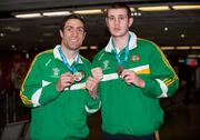 28 November 2011; Kenny Egan, left, and Con Sheehan on their arrival at Dublin airport following the Olympic Test Event at the ExCel in London where they both won Gold. Irish Team Return from Olympic Test Event Finals, Dublin Airport, Dublin. Picture credit: Barry Cregg / SPORTSFILE