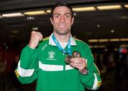 28 November 2011; Kenny Egan on his arrival at Dublin airport following the Olympic Test Event at the ExCel in London where he won Gold in the Light-Heavyweight category. Irish Team Return from Olympic Test Event Finals, Dublin Airport, Dublin. Picture credit: Barry Cregg / SPORTSFILE