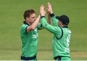 21 May 2017; Craig Young of Ireland, left, celebrates with team-mate William Porterfield after bowling Luke Ronchi of New Zealand during the One Day International match between Ireland and New Zealand at Malahide Cricket Club in Dublin. Photo by Cody Glenn/Sportsfile