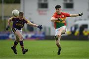21 May 2017; Ryan Hollick of Carlow in action against Peadar Cowman of Wexford during the Electric Ireland Leinster GAA Football Minor Championship Quarter Final match between Carlow and Wexford at Netwatch Cullen Park in Carlow. Photo by Ramsey Cardy/Sportsfile