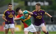 21 May 2017; Gavin Healy of Carlow is tackled by Adam Hogan of Wexford during the Electric Ireland Leinster GAA Football Minor Championship Quarter Final match between Carlow and Wexford at Netwatch Cullen Park in Carlow. Photo by Ramsey Cardy/Sportsfile