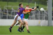 21 May 2017; Hugh Dooley of Carlow is tackled by Peadar Cowman of Wexford during the Electric Ireland Leinster GAA Football Minor Championship Quarter Final match between Carlow and Wexford at Netwatch Cullen Park in Carlow. Photo by Ramsey Cardy/Sportsfile