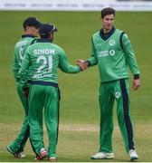 21 May 2017; George Dockrell of Ireland is congratulated by team-mates Simi Singh and William Porterfield after stumping Tom Latham of New Zealand during the One Day International match between Ireland and New Zealand at Malahide Cricket Club in Dublin. Photo by Cody Glenn/Sportsfile