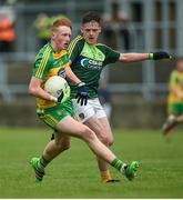 21 May 2017; Oisin Gallen of Donegal in action against Eamon Kelly of Antrim during the Electric Ireland Ulster GAA Football Minor Championship Quarter-Final match between Donegal and Antrim at MacCumhaill Park in Ballybofey, Co Donegal. Photo by Oliver McVeigh/Sportsfile