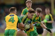 21 May 2017; Eoghan McCabe of Antrim in action against Carl McGlynn and Aaron Deeney of Donegal during the Electric Ireland Ulster GAA Football Minor Championship Quarter-Final match between Donegal and Antrim at MacCumhaill Park in Ballybofey, Co Donegal. Photo by Oliver McVeigh/Sportsfile