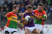 21 May 2017; Brian Malone of Wexford in action against Danny Moran, left, and Eoghan Ruth of Carlow during the Leinster GAA Football Senior Championship Round 1 match between Carlow and Wexford at Netwatch Cullen Park in Carlow. Photo by Ramsey Cardy/Sportsfile