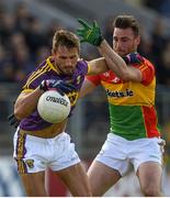 21 May 2017; Brian Malone of Wexford in action against Eoghan Ruth of Carlow during the Leinster GAA Football Senior Championship Round 1 match between Carlow and Wexford at Netwatch Cullen Park in Carlow. Photo by Ramsey Cardy/Sportsfile