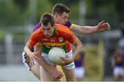 21 May 2017; Sean Gannon of Carlow is tackled by Naomhan Rossiter of Wexford during the Leinster GAA Football Senior Championship Round 1 match between Carlow and Wexford at Netwatch Cullen Park in Carlow. Photo by Ramsey Cardy/Sportsfile