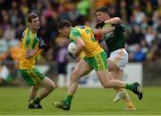 20 May 2017; Paddy McGrath of Donegal   in action against Tomas McCann of Antrim during the Ulster GAA Football Senior Championship Quarter-Final match between Donegal and Antrim at MacCumhaill Park in Ballybofey, Co Donegal. Photo by Oliver McVeigh/Sportsfile
