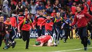 21 May 2017; Seamus Harnedy of Cork falls to his knees as Cork supporters rush to celebrate victory, over Tipperary, after the Munster GAA Hurling Senior Championship Semi-Final match between Tipperary and Cork at Semple Stadium in Thurles, Co Tipperary. Photo by Ray McManus/Sportsfile