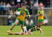 20 May 2017; Eóin McHugh of Donegal in action against Declan Lynch of Antrim during the Ulster GAA Football Senior Championship Quarter-Final match between Donegal and Antrim at MacCumhaill Park in Ballybofey, Co Donegal. . Photo by Oliver McVeigh/Sportsfile