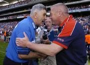18 July 2004; Paidi O'Se, right, Westmeath manager, shakes hands with Laois manager Mick O'Dwyer at the end of the game. Bank of Ireland Leinster Senior Football Championship Final, Laois v Westmeath, Croke Park, Dublin. Picture credit; David Maher / SPORTSFILE