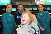 29 November 2011; Aer Lingus announces it will be the official airline partner of Dublin GAA in a three year sponsorship agreement. The GAA All Ireland Football Champions, their manager Pat Gilroy and families were in T2 today, Tuesday 29 November, preparing to fly out to Orlando, Florida, courtesy of Aer Lingus. Pictured is Jamie Brogan, age 2, son of Alan Brogan and his wife Lydia, second from right, with Aer Lingus staff Jamie-Leigh Arthurs, left, and Aine Behan. Dublin Airport, Dublin. Picture credit: Brian Lawless / SPORTSFILE