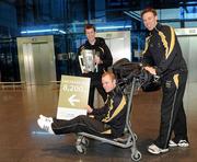 30 November 2011; Kilkenny hurlers Tommy Walsh, centre, Michael Rice, left, and Brian Hogan, prior to departure for San Francisco for the GAA GPA All-Stars Tour 2011 sponsored by Opel.  Dublin Airport, Dublin. Picture credit: Brian Lawless / SPORTSFILE