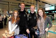 30 November 2011; Kilkenny hurlers Michael Fennelly with Mairead Martin, left, and JJ Delaney with Ashling Tobin, prior to departure for San Francisco for the GAA GPA All-Stars Tour 2011 sponsored by Opel.  Dublin Airport, Dublin. Picture credit: Brian Lawless / SPORTSFILE