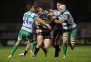 2 December 2011; Mark McCrea, centre, Connacht, with support from team-mate Dave McSharry, is tackled by Tommaso Iannone, left, and Benjamin Vermaak, Treviso. Celtic League, Connacht v Treviso, Sportsground, Galway. Picture credit: Barry Cregg / SPORTSFILE