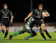2 December 2011; John Muldoon, Connacht, is tackled by Francesco Minto, Treviso. Celtic League, Connacht v Treviso, Sportsground, Galway. Picture credit: Barry Cregg / SPORTSFILE