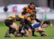 3 December 2011; Robert Clune, Cork Constitution, is tackled by Willie Staunton, left, Andrew Burke and Darragh O'Neill, above, Young Munster. Ulster Bank League, Division 1A, Cork Constitution v Young Munster, Temple Hill, Cork. Picture credit: Stephen McCarthy / SPORTSFILE