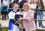 20 May 2017; Munster captain Martina O'Brien is presented with medals by Marie Hickey, President of the LGFA, following the MMI Ladies Football Interprovincial Tournament final between Munster and Ulster at Gavan Diffy Park in Monaghan. Photo by Ramsey Cardy/Sportsfile