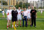 21 January 2005; Manager John Maughan, right, Mayo players, l to r, James Nallen, Ciaran McDonald, David Heaney and Ronan McGarrity with the Treasurer of the Hong Kong club Pat Foy, Murrisk, Wesport, Co Mayo, and his two and a half year old son Oliver after training in advance of the 2004 Vodafone All-Stars Exhibition Game, 2003 Vodafone All-Stars v 2004 Vodafone All-Stars, Hong Kong Football Club, Hong Kong, China. Picture credit; Ray McManus / SPORTSFILE