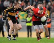 4 December 2011; Tom Clancy, UCC, in action against Colm Cooper, Dr. Crokes. AIB Munster GAA Football Senior Club Championship Final, Dr. Crokes v UCC, Fitzgerald Stadium, Killarney, Co. Kerry. Picture credit: Diarmuid Greene / SPORTSFILE