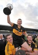 4 December 2011; Dr. Crokes captain Luke Quinn, lifted by team-mates Alan Kelly, left, and Andrew Kenneally, celebrates with the cup after victory over UCC. AIB Munster GAA Football Senior Club Championship Final, Dr. Crokes v UCC, Fitzgerald Stadium, Killarney, Co. Kerry. Picture credit: Diarmuid Greene / SPORTSFILE
