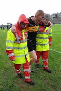 4 December 2011; Johnny Buckley, Dr. Crokes, is assisted off the pitch at the end of the game after victory over UCC. AIB Munster GAA Football Senior Club Championship Final, Dr. Crokes v UCC, Fitzgerald Stadium, Killarney, Co. Kerry. Picture credit: Diarmuid Greene / SPORTSFILE