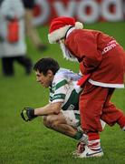 4 December 2011; Craig Rogers, Portlaoise, Laois, is consoled by a St. Brigid's supporter after the match. AIB Leinster GAA Football Senior Club Championship Semi-Final, St Brigid's, Dublin v Portlaoise, Laois, Parnell Park, Dublin. Picture credit: Brian Lawless / SPORTSFILE