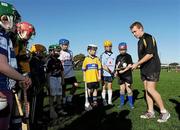 3 December 2011; Kilkenny's Adrian Ronan with children from the San Francisco GAA Club during a coaching session organised as part of the tour. 2011 GAA GPA All-Stars Hurling Tour sponsored by Opel, Treasure Island, San Francisco, California, USA. Picture credit: Ray McManus / SPORTSFILE