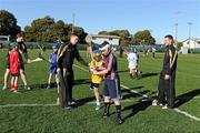3 December 2011; Brian Hogan, left, Kilkenny, Brendan Maher, Tipperary, and Michael Walsh, Waterford, with children from the San Francisco GAA Club during a coaching session organised as part of the tour. 2011 GAA GPA All-Stars Hurling Tour sponsored by Opel, Treasure Island, San Francisco, California, USA. Picture credit: Ray McManus / SPORTSFILE