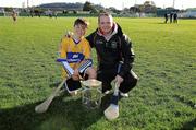 3 December 2011; Clare manager Davy Fitzgerald with Conor Cassidy from the San Francisco GAA Club, and the Liam MacCarthy Cup, after a coaching session organised as part of the tour. Conor's dad, Leo, is from Kilfinora, Co Clare. 2011 GAA GPA All-Stars Hurling Tour sponsored by Opel, Treasure Island, San Francisco, California, USA. Picture credit: Ray McManus / SPORTSFILE