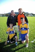 3 December 2011; Clare manager Davy Fitzgerald with Leo Cassidy, from Kilfinora, Co. Clare, and his two sons Conor, left, and Kevin from the San Francisco GAA Club, and the Liam MacCarthy Cup, after a coaching session organised as part of the tour. 2011 GAA GPA All-Stars Hurling Tour sponsored by Opel, Treasure Island, San Francisco, California, USA. Picture credit: Ray McManus / SPORTSFILE