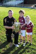 3 December 2011; Galway star Damien Hayes with Keelin, 7 years, and Ardan Walsh, four and a half, from the San Francisco GAA Club and the Liam MacCarthy Cup after a coaching session organised as part of the tour. Their dad is Vivian is from Ballinasloe and mother Ita from Aughrim, Co Galway, 2011 GAA GPA All-Stars Hurling Tour sponsored by Opel, Treasure Island, San Francisco, California, USA. Picture credit: Ray McManus / SPORTSFILE