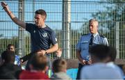 26 May 2017; Community Garda Pat Courtney, right, watches on as FAI Development Officer Mark Connors, left, talks to players ahead of the FAI South Dublin County Council Late Night League Finals at Astropark in Tallaght, Dublin. Photo by Seb Daly/Sportsfile