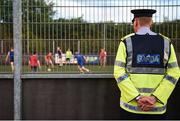 26 May 2017; Inspector Gerard Meally, of Lucan Garda Station, watches the action during the FAI South Dublin County Council Late Night League Finals at Astropark in Tallaght, Dublin. Photo by Seb Daly/Sportsfile