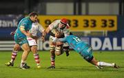 9 December 2011; Johann Muller, Ulster, is tackled by Lorenzo Romano and Gabriel Pizarro, Aironi. Heineken Cup, Pool 4, Round 3, Ulster v Aironi, Ravenhill Park, Belfast, Co. Antrim. Picture credit: Oliver McVeigh / SPORTSFILE