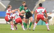 10 December 2011; Dave McSharry, Connacht, is tackled by, from left, James Simpson-Daniel, Freddie Burns and Eliota Fuimano-Sapolu, Gloucester. Heineken Cup, Pool 6, Round 3, Connacht v Gloucester, Sportsground, Galway. Picture credit: Pat Murphy / SPORTSFILE