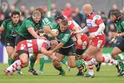 10 December 2011; Ethienne Reynecke, Connacht, is tackled by, from left, Scott Lawson, Peter Buxton and Nick Wood, Gloucester. Heineken Cup, Pool 6, Round 3, Connacht v Gloucester, Sportsground, Galway. Picture credit: Pat Murphy / SPORTSFILE
