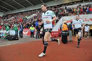 10 December 2011; Munster's Ronan O'Gara makes his way out onto the pitch on the occasion of his 100th Heineken Cup appearance. Heineken Cup, Pool 1, Round 3, Scarlets v Munster, Parc Y Scarlets, Llanelli, Wales. Picture credit: Diarmuid Greene / SPORTSFILE