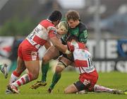 10 December 2011; Kyle Tonetti, Connacht, is tackled by Eliota Fuimaono-Sapolu, left, and Freddie Burns, Gloucester. Heineken Cup, Pool 6, Round 3, Connacht v Gloucester, Sportsground, Galway. Picture credit: Pat Murphy / SPORTSFILE