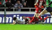 10 December 2011; Niall Ronan, Munster, scores his side's first try despite the efforts of Matthew Rees, Scarlets. Heineken Cup, Pool 1, Round 3, Scarlets v Munster, Parc Y Scarlets, Llanelli, Wales. Picture credit: Diarmuid Greene / SPORTSFILE