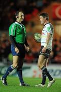10 December 2011; Ronan O'Gara, Munster, shares a laugh with referee Romain Poite during the game. Heineken Cup, Pool 1, Round 3, Scarlets v Munster, Parc Y Scarlets, Llanelli, Wales. Picture credit: Diarmuid Greene / SPORTSFILE
