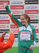 11 December 2011; Fionnuala Britton, Ireland, celebrates before being presented with her gold medal following her Senior Women's event victory at the 18th SPAR European Cross Country Championships 2011. Velenje, Slovenia. Picture credit: Stephen McCarthy / SPORTSFILE