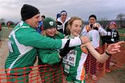 11 December 2011; Fionnuala Britton, Ireland, is congratulated by team coaches Neil Martin and Theresa McDaid after winning the Senior Women's event at the 18th SPAR European Cross Country Championships 2011. Velenje, Slovenia. Picture credit: Stephen McCarthy / SPORTSFILE
