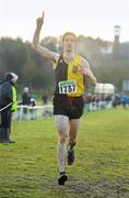 11 December 2011; Eoin Everard, Kilkenny City Harriers, celebrates as he crosses the finish line to win the Men's Novice race during the Woodie’s DIY Novice and Juvenile Cross Country Championships. Curragh Camp, The Curragh, Co. Kildare. Picture credit: Pat Murphy / SPORTSFILE
