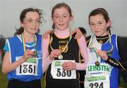 11 December 2011; Julia Healy, Dublin, winner, with second placed Sophie Harrington, Cork, left, and third placed Danielle Donegan, Tullamore Harriers AC, right, after the Girl's U11 race at the Woodie’s DIY Novice and Juvenile Cross Country Championships. Curragh Camp, The Curragh, Co. Kildare. Picture credit: Pat Murphy / SPORTSFILE