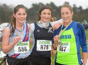 11 December 2011; Yasmin Wilson, Antrim, winner, with second placed Sarah Hawkshaw, Dublin, right, and third placed Sorcha Humphries, Dundrum South Dublin, left, after the Girl's U17 race at the Woodie’s DIY Novice and Juvenile Cross Country Championships. Curragh Camp, The Curragh, Co. Kildare. Picture credit: Pat Murphy / SPORTSFILE
