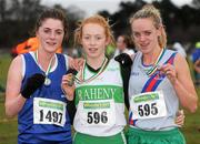 11 December 2011; Alice Fennell, Raheny Shamrocks AC, winner, with second placed Imogen Cotter, Cork, left, and third placed Meghan Ryan, Dundrum South Dublin AC, right, after the Girl's U19 race at the Woodie’s DIY Novice and Juvenile Cross Country Championships. Curragh Camp, The Curragh, Co. Kildare. Picture credit: Pat Murphy / SPORTSFILE